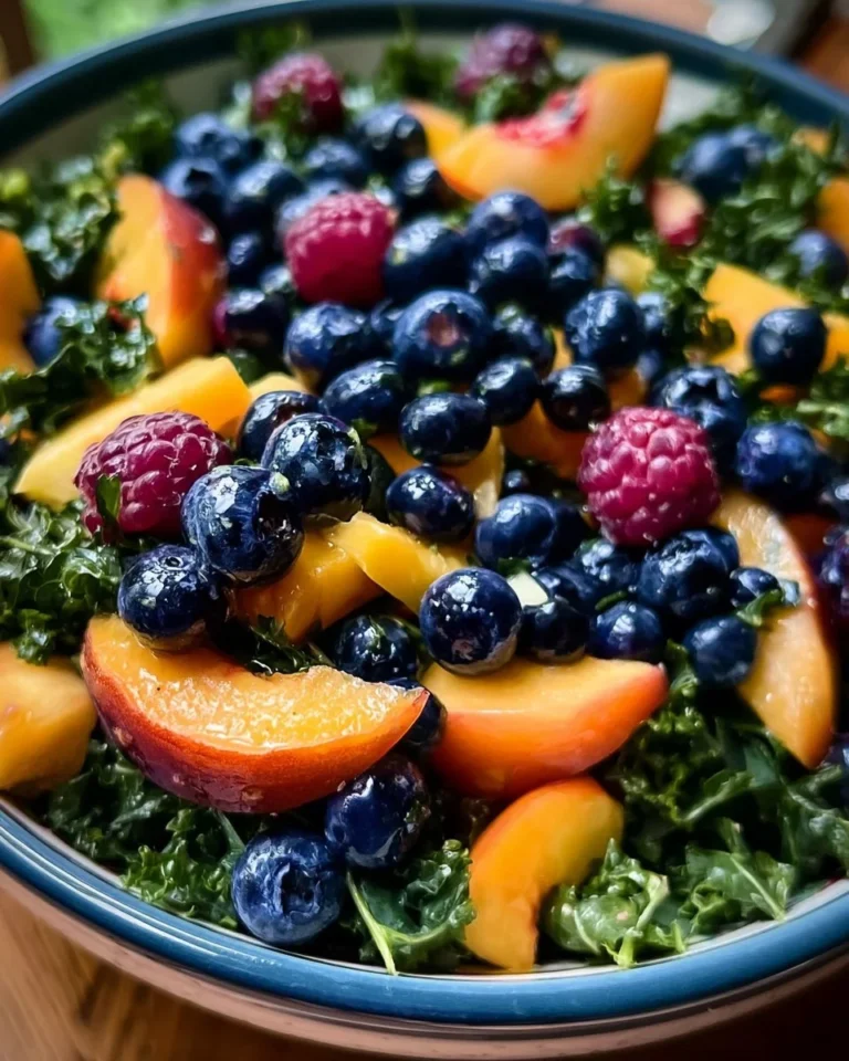 Colorful Peach Blueberry Kale Salad with fresh ingredients