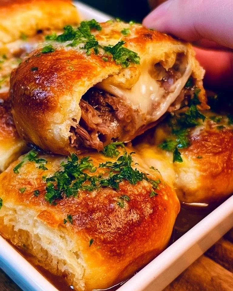 Homemade French Dip Sliders served with au jus for dipping