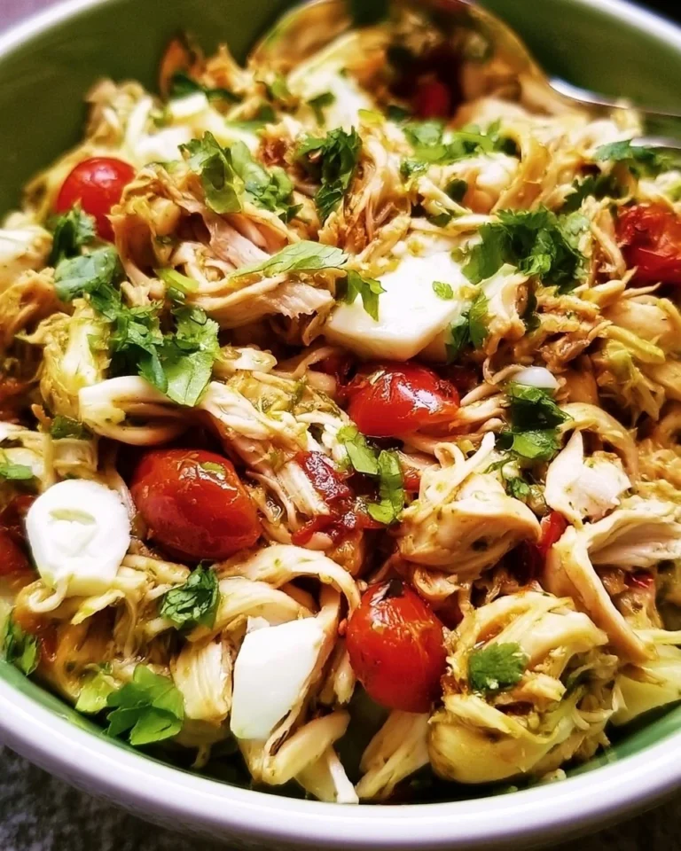 Plate of tender and flavorful shredded chicken for various dishes