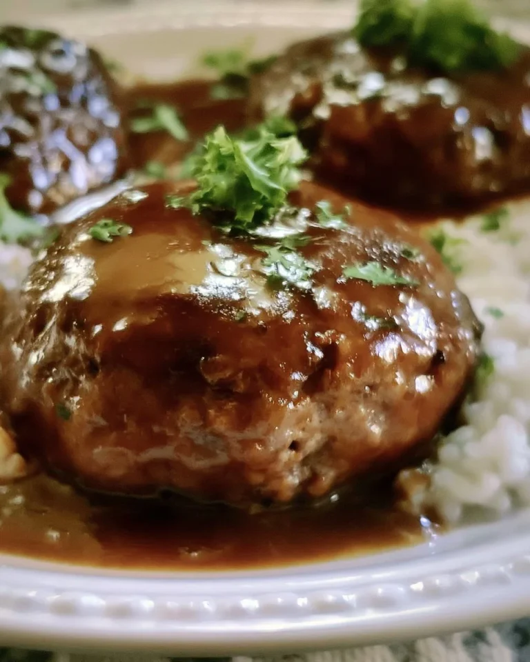 Delicious homemade Salisbury steak served with gravy and mashed potatoes