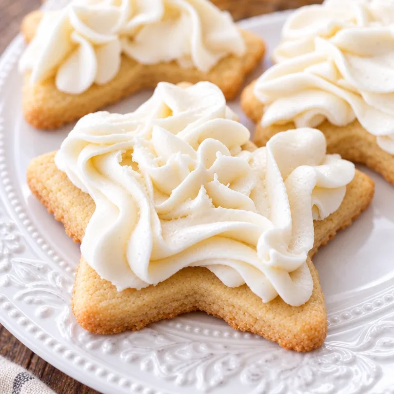 Deliciously creamy vanilla buttercream frosting on sugar cookies